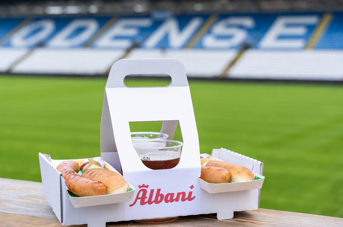 Elevating convenience and sustainability at Danish football club Odense Boldklub by helping fans carry food and drinks easily in the stadium while reducing waste.
